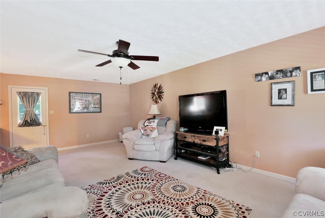 2606 Iverson Road Midlothian, VA 23112 - Photo 4 of 19 a living room with furniture and a flat screen tv