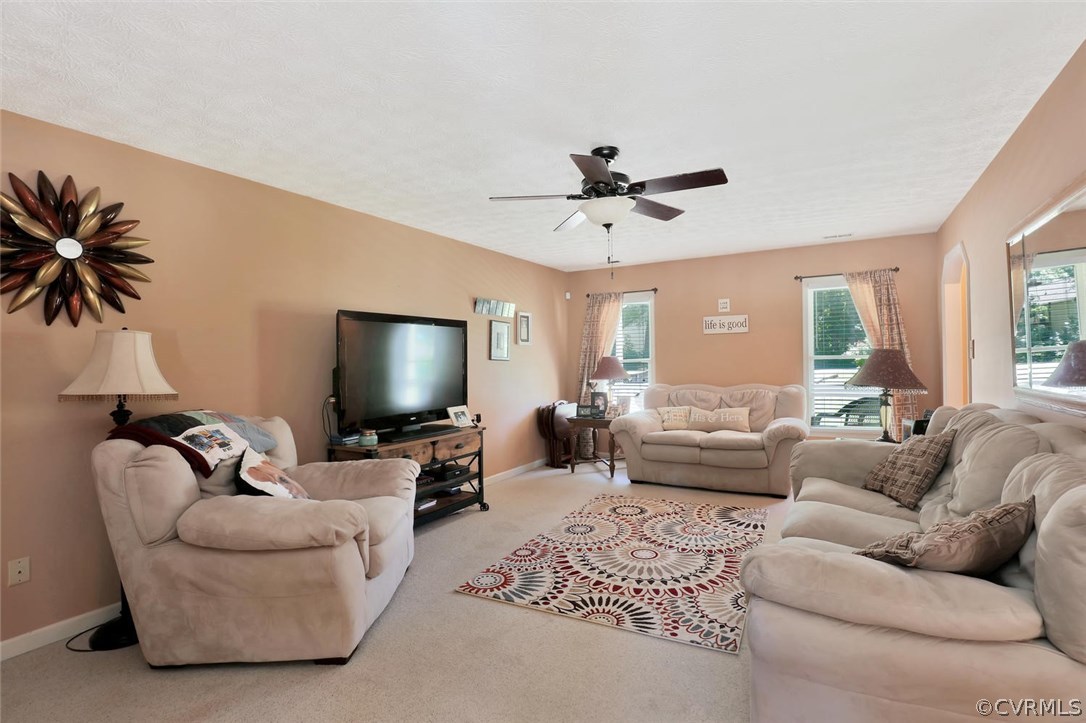 2606 Iverson Road Midlothian, VA 23112 - Photo 5 of 19 a living room with furniture and a flat screen tv