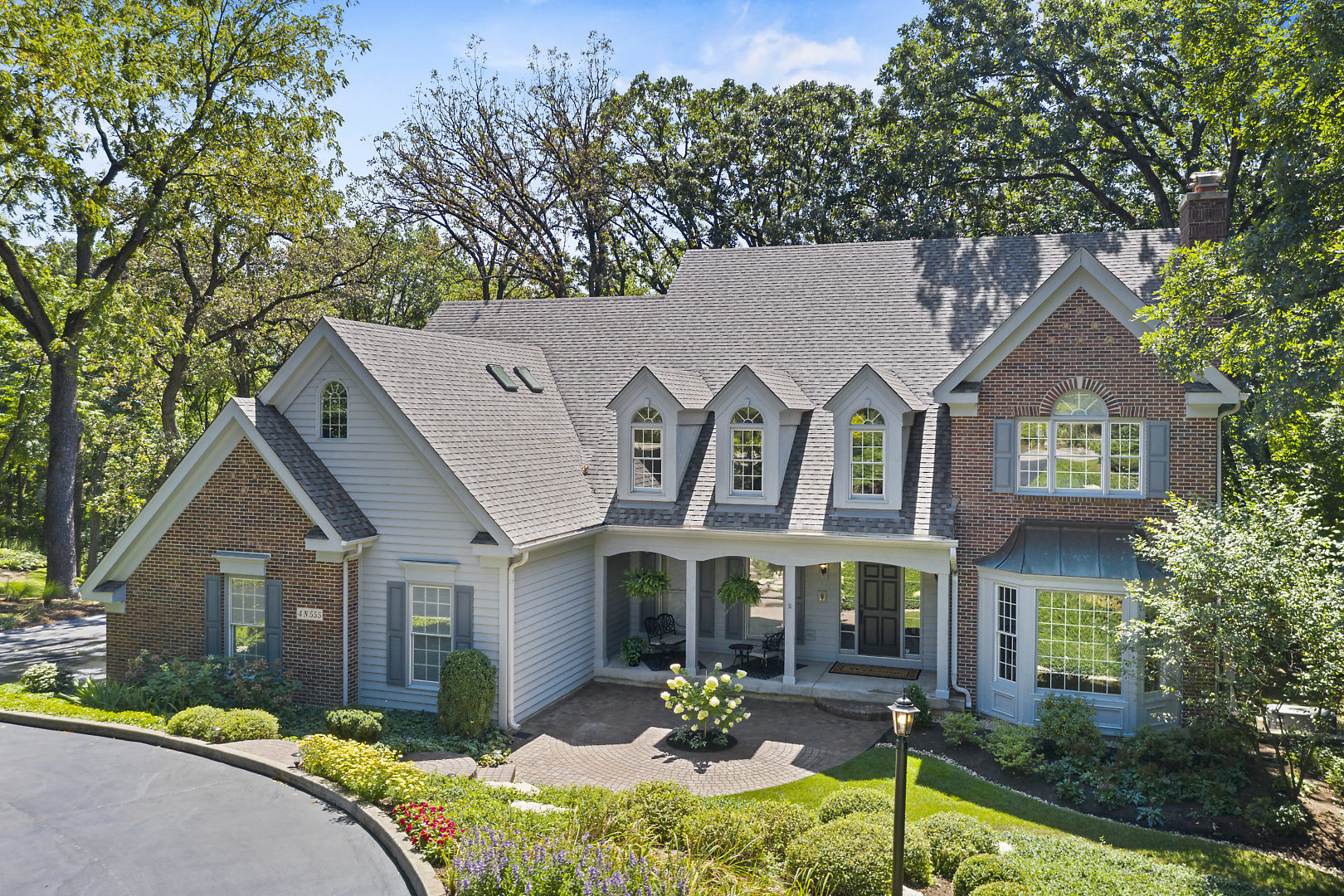 4N555 Hidden Oaks Road St. Charles, IL 60175 - Photo 1 of 41 a front view of a house with garden