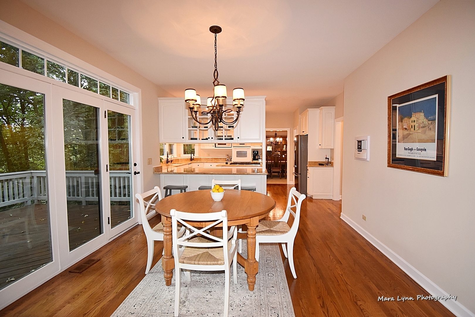 4N555 Hidden Oaks Road St. Charles, IL 60175 - Photo 11 of 41 a view of a dining room with furniture wooden floor and chandelier