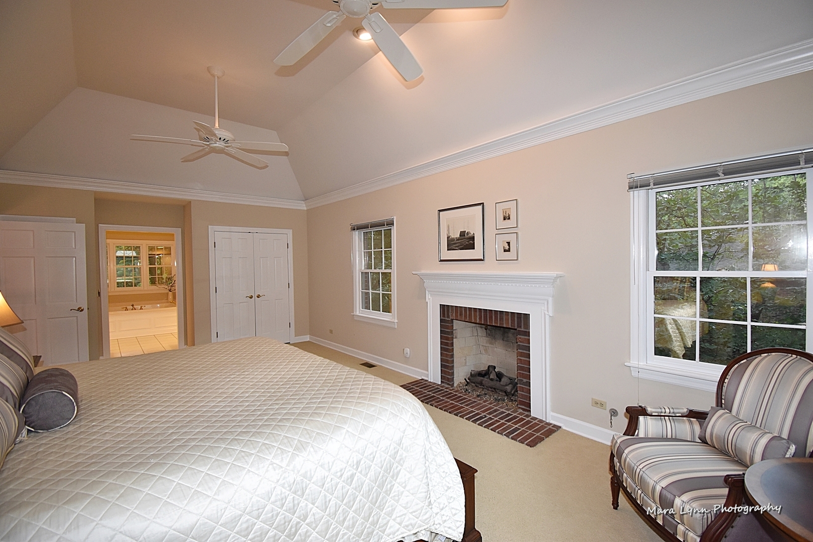 4N555 Hidden Oaks Road St. Charles, IL 60175 - Photo 25 of 41 a bedroom with a bed and a fireplace