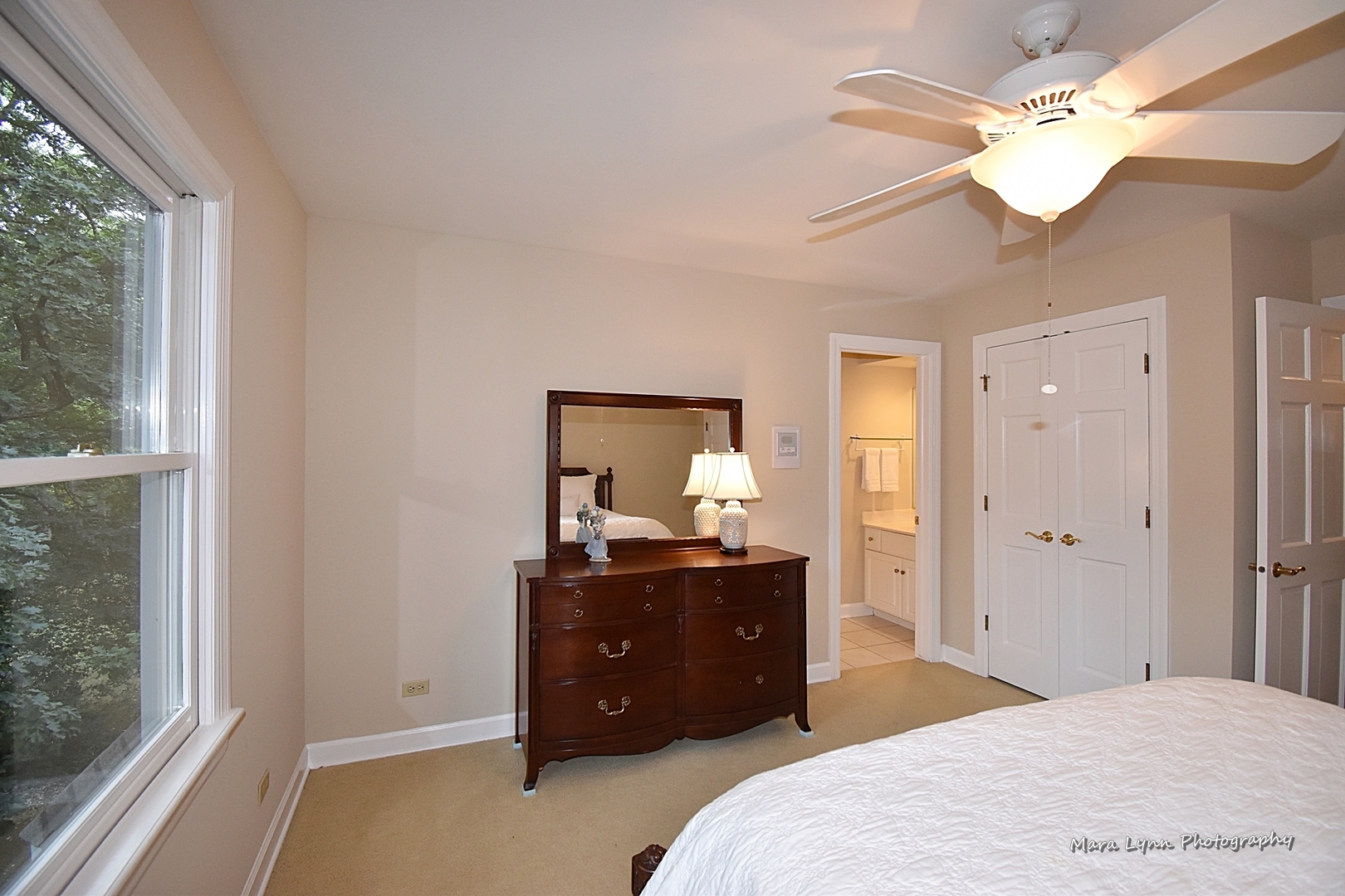 4N555 Hidden Oaks Road St. Charles, IL 60175 - Photo 28 of 41 a bedroom with a bed and a chandelier