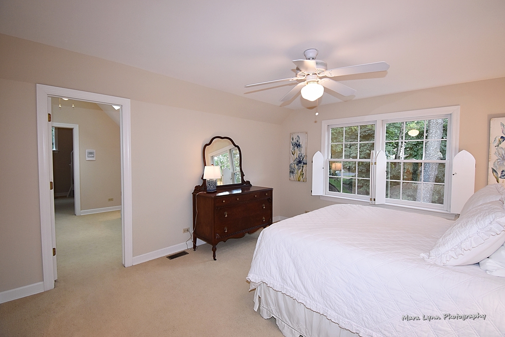 4N555 Hidden Oaks Road St. Charles, IL 60175 - Photo 33 of 41 a bedroom with a bed and a chandelier