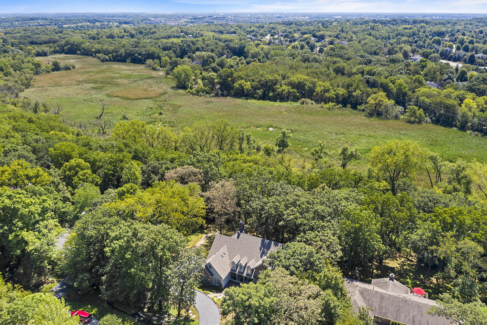 4N555 Hidden Oaks Road St. Charles, IL 60175 - Photo 36 of 41 an aerial view of residential houses with outdoor space and trees