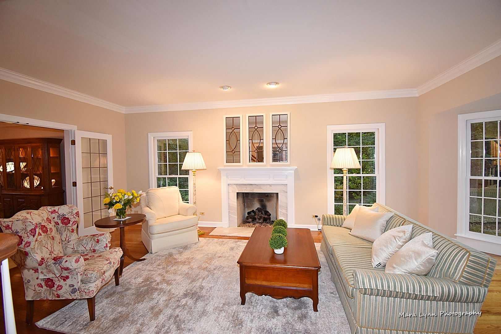 4N555 Hidden Oaks Road St. Charles, IL 60175 - Photo 7 of 41 a living room with furniture fireplace and a large window