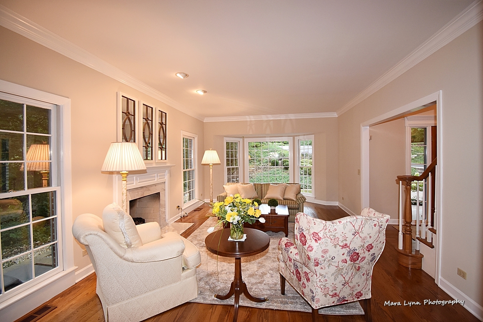 4N555 Hidden Oaks Road St. Charles, IL 60175 - Photo 8 of 41 a living room with furniture a fireplace and a large window