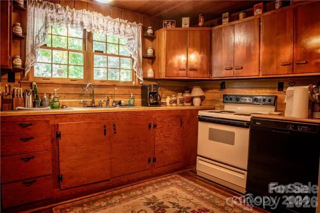 a bedroom with bed and a chandelier