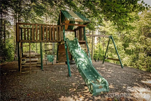 a view of a porch with furniture and backyard
