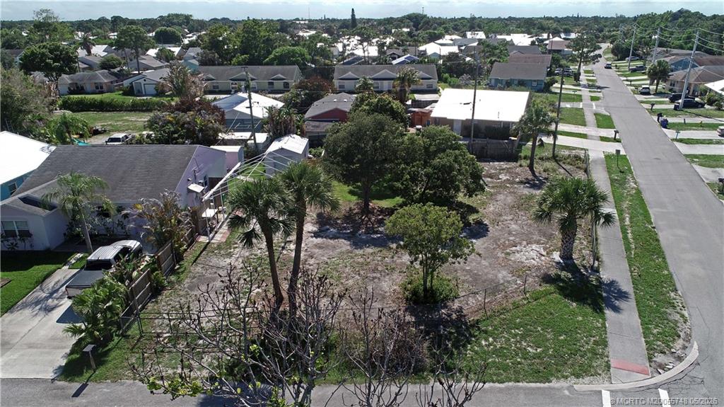 5152 Southeast Primrose Way Stuart, FL 34997 - Photo 13 of 13 an aerial view of residential houses with outdoor space