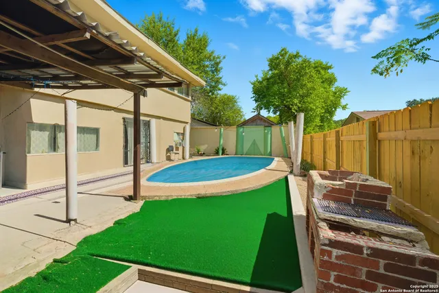 a view of a backyard with a small cabin