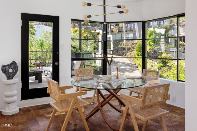 a kitchen with stainless steel appliances a sink stove and refrigerator