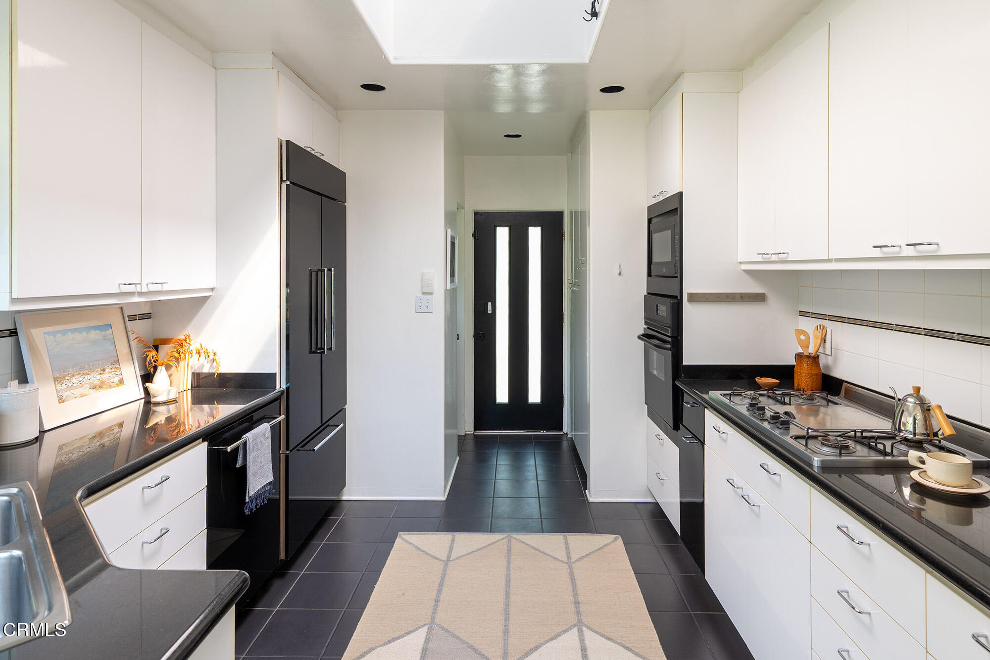 412 Glen Holly Drive Pasadena, CA 91105 - Photo 8 of 18 a kitchen with stainless steel appliances a sink stove and refrigerator