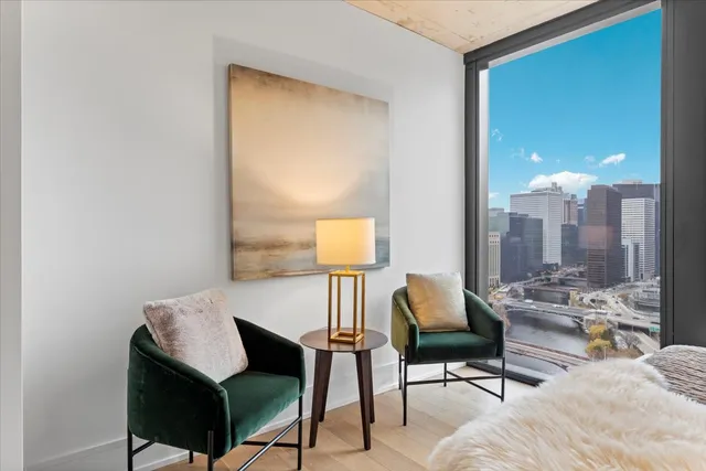 a living room with furniture and a lamp