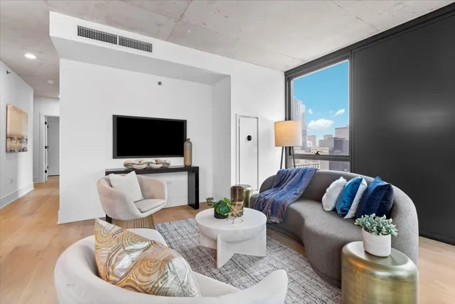 a living room with furniture and a flat screen tv