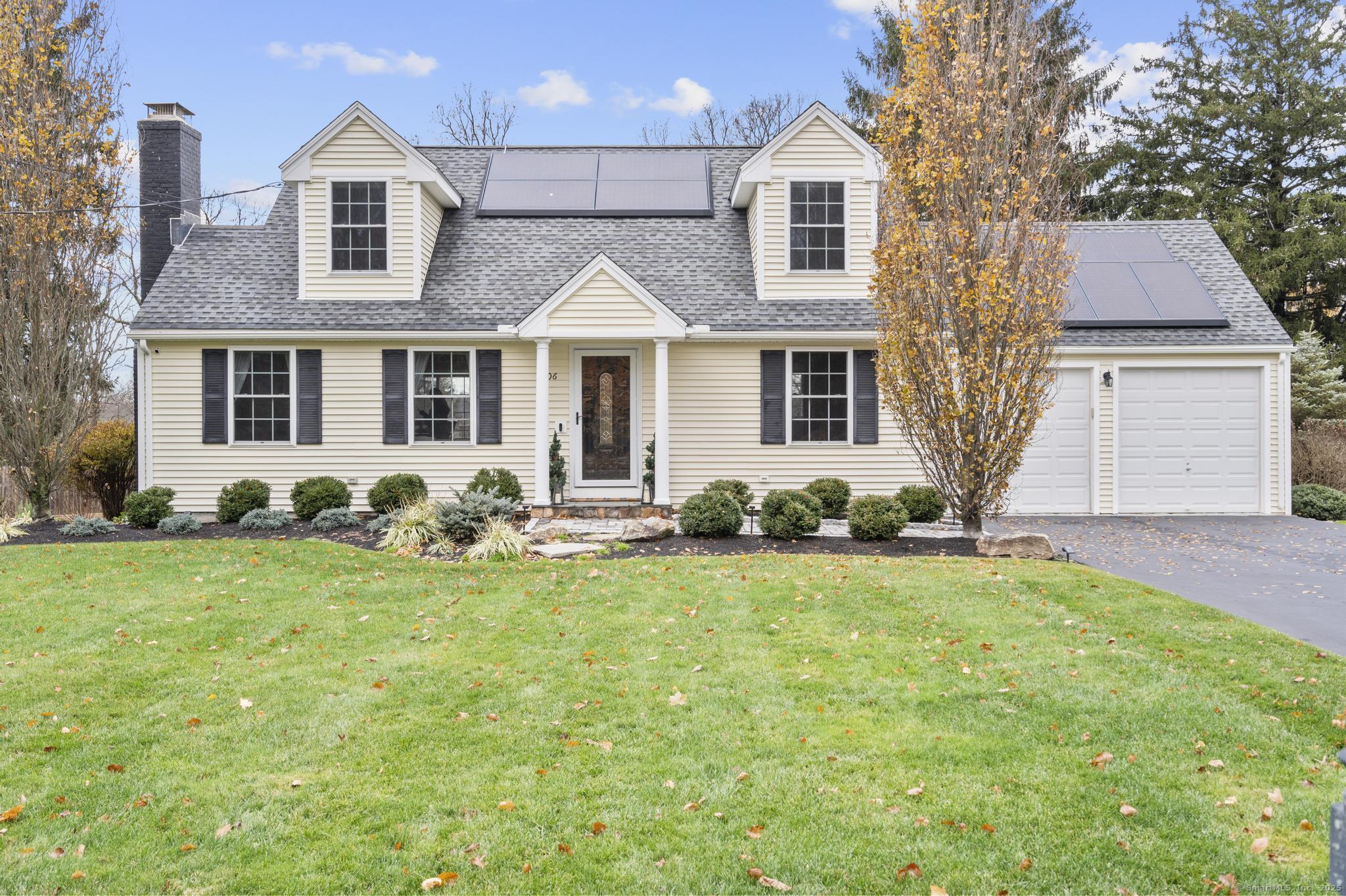 front view of a house with a yard