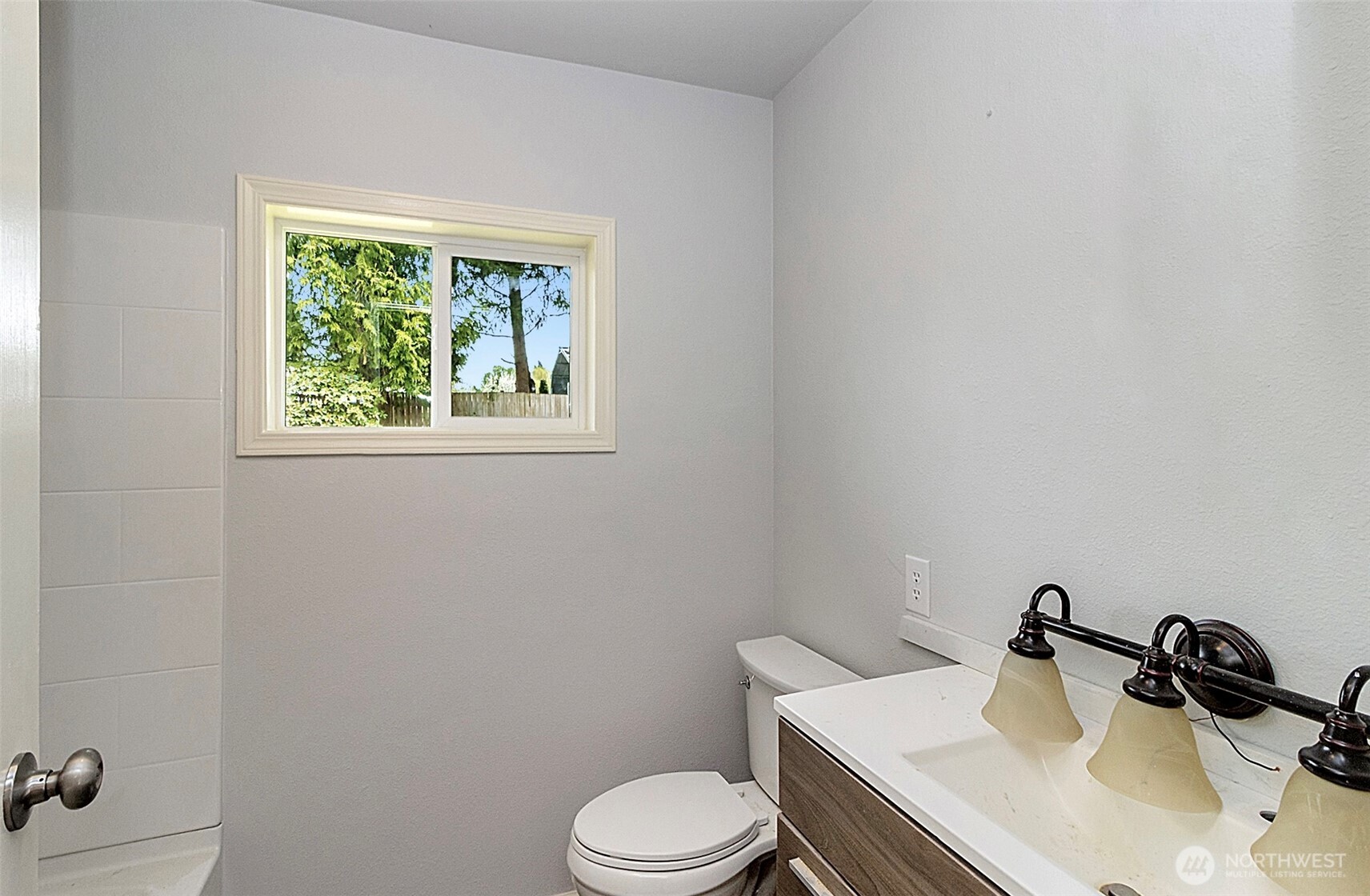 2325 Cherry Road, Unit B Lake Stevens, WA 98258 - Photo 11 of 13 a bathroom with a sink a toilet and mirror