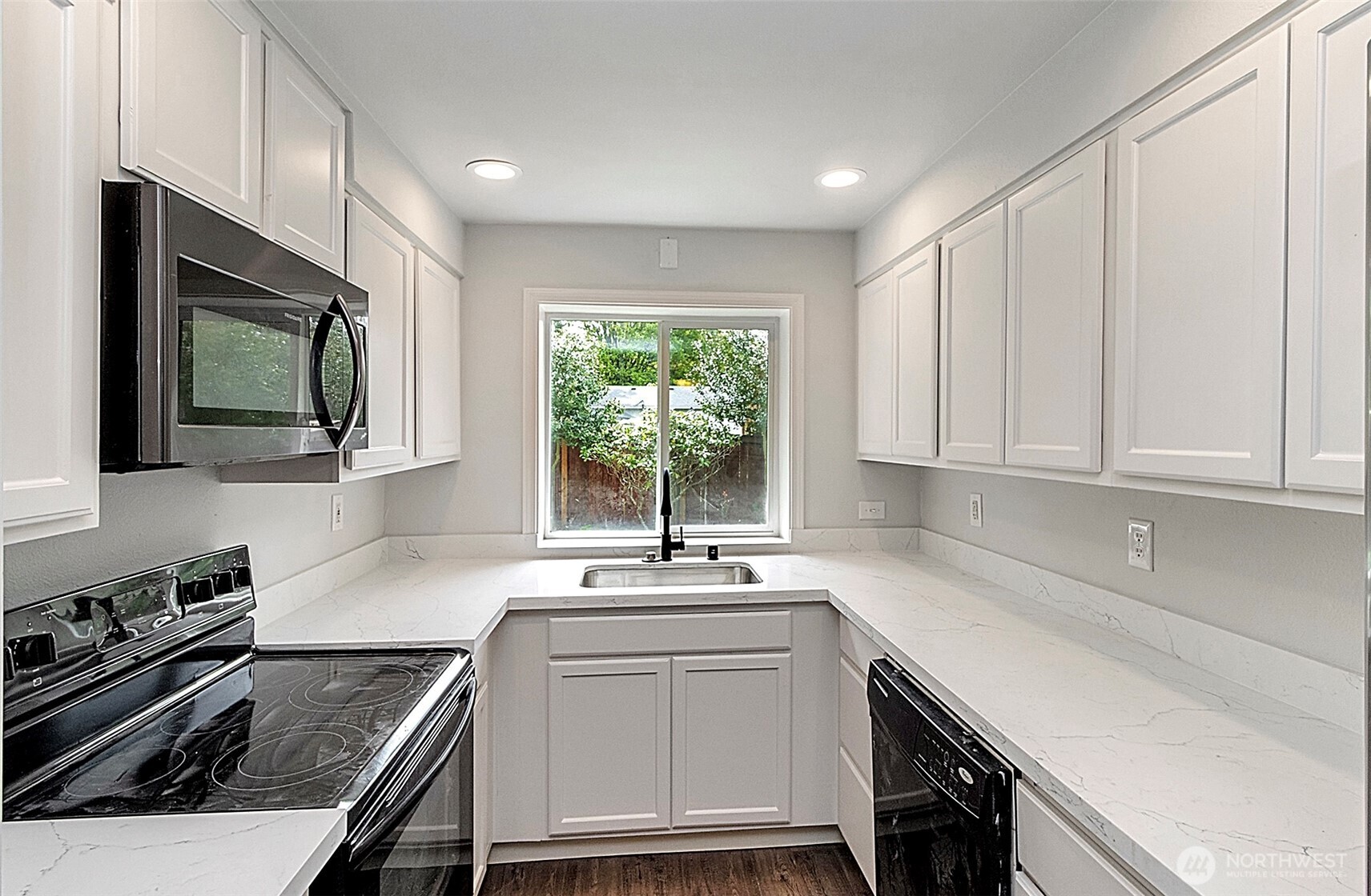 2325 Cherry Road, Unit B Lake Stevens, WA 98258 - Photo 7 of 13 a kitchen with a sink stove and microwave
