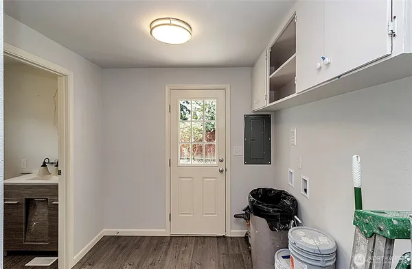 a bathroom with a sink a toilet and tub