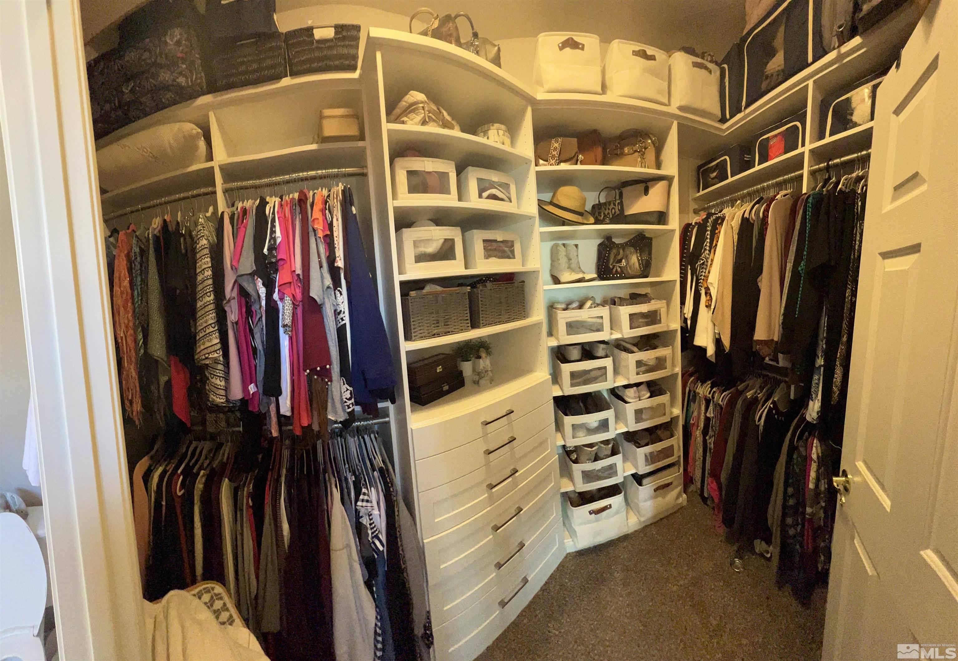 1085 Tee Drive Minden, NV 89423 - Photo 23 of 29 a view of walk in closet with clothes and shoes