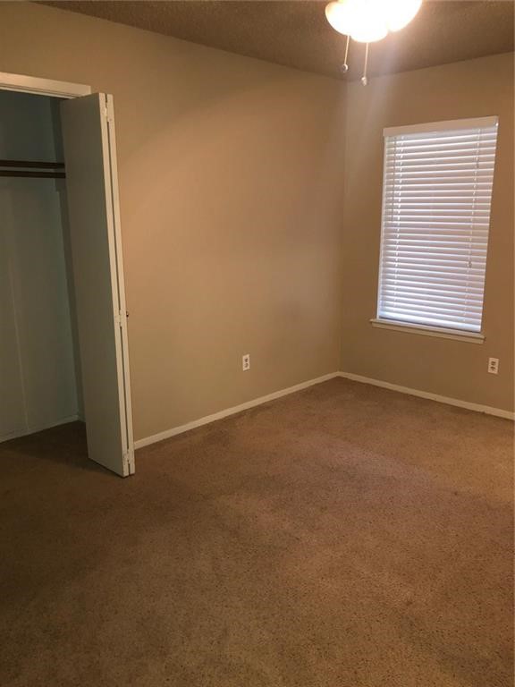 3734 Lott Avenue, Unit 4 Corpus Christi, TX 78410 - Photo 5 of 7 an empty room with windows