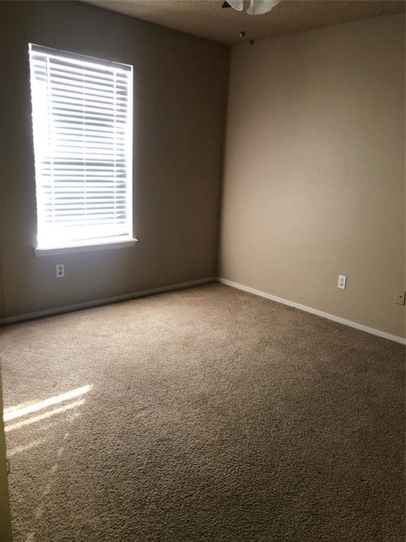 3734 Lott Avenue, Unit 4 Corpus Christi, TX 78410 - Photo 6 of 7 a view of an empty room with a window