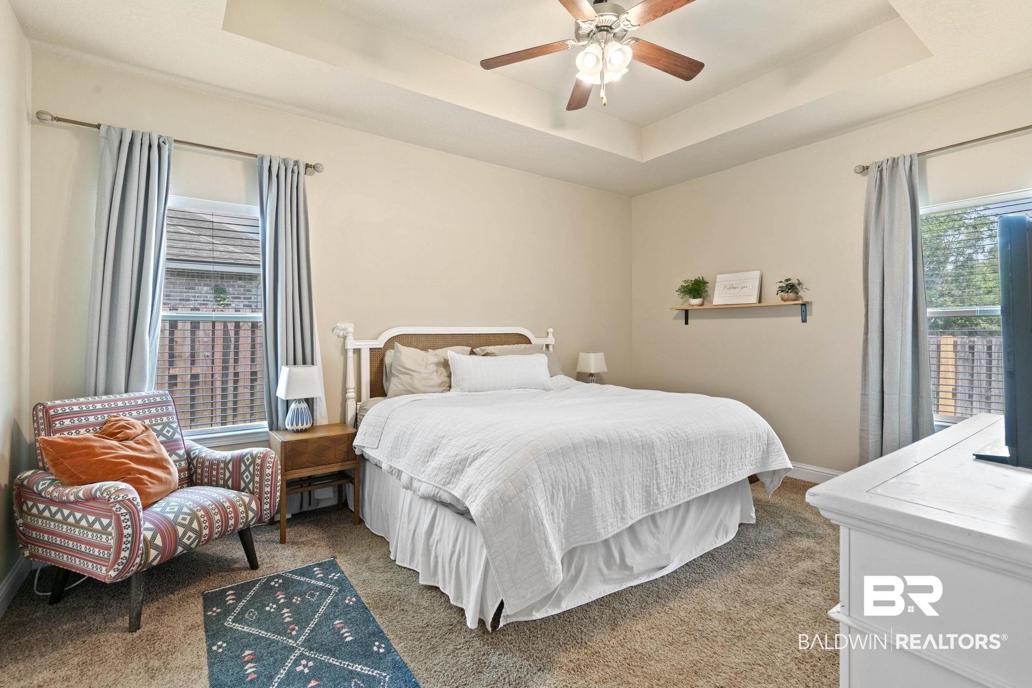 2216 Livingstone Court Mobile, AL 36695 - Photo 20 of 62 Carpeted bedroom with tray ceiling and ceiling fan