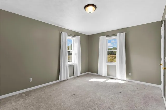 a view of hallway with wooden floor