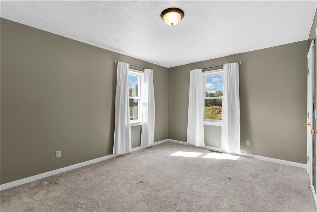 409 Bower Road Fredonia, PA 16124 - Photo 28 of 48 an empty room with windows and closet