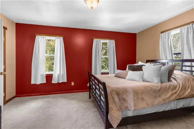 a bathroom with a granite countertop sink and a bathtub