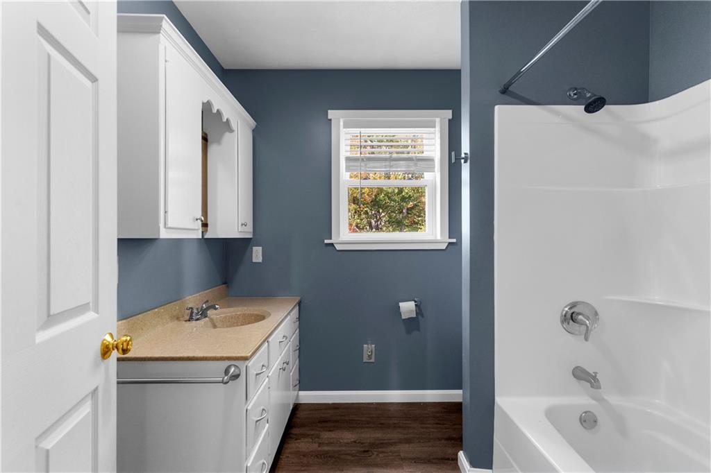 409 Bower Road Fredonia, PA 16124 - Photo 31 of 48 a bathroom with a granite countertop sink and a bathtub
