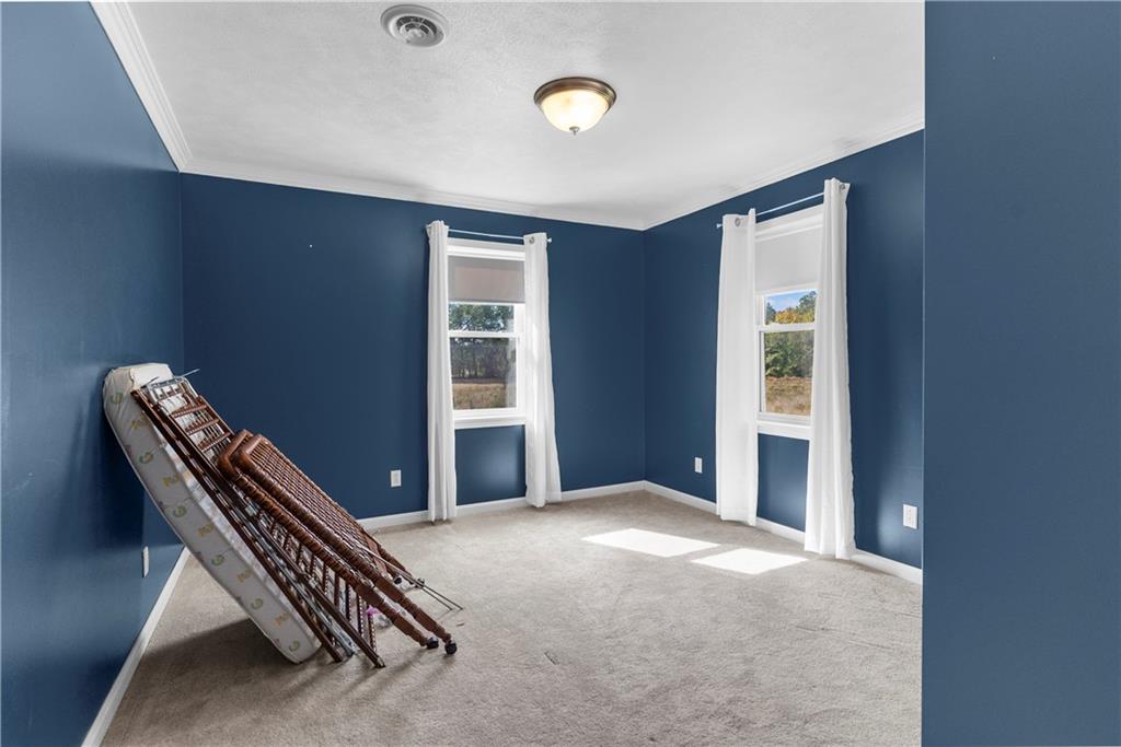 409 Bower Road Fredonia, PA 16124 - Photo 32 of 48 a view of an empty room with a window