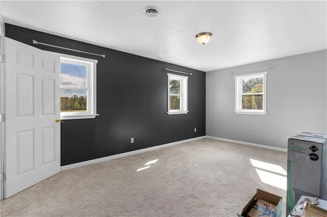 a room with a bed and a window