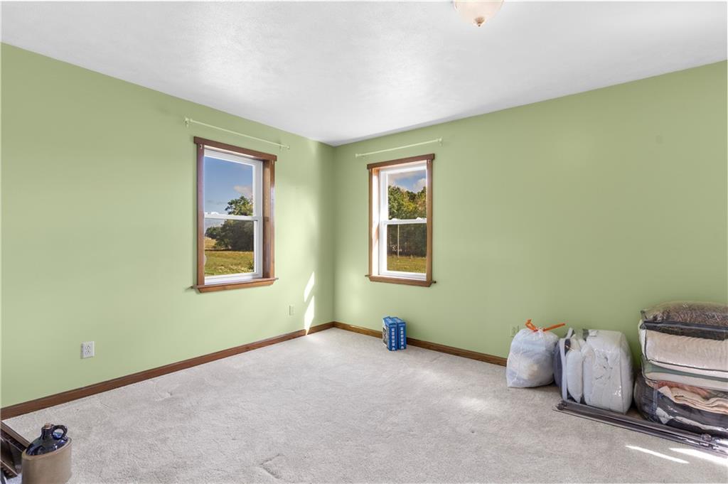 409 Bower Road Fredonia, PA 16124 - Photo 34 of 48 a room with a bed and a window