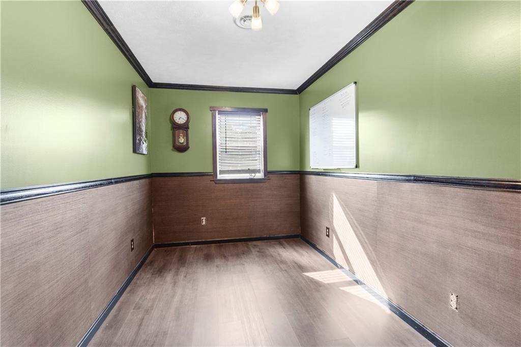 409 Bower Road Fredonia, PA 16124 - Photo 36 of 48 an empty room with wooden floor and windows