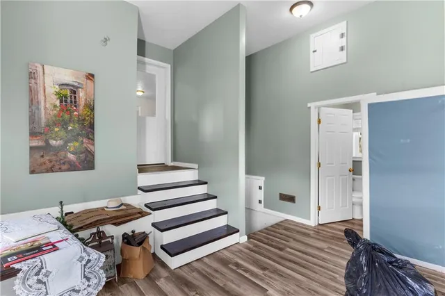 a view of a livingroom with wooden floor