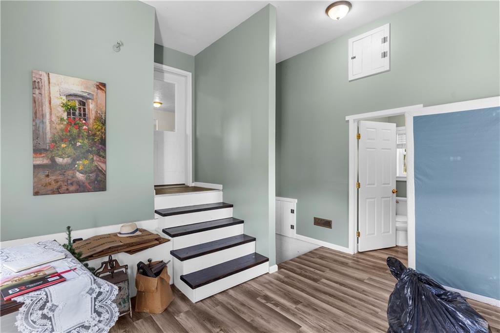 409 Bower Road Fredonia, PA 16124 - Photo 37 of 48 a bedroom with a bed and wooden floor