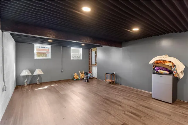 a room with furniture and gym equipment