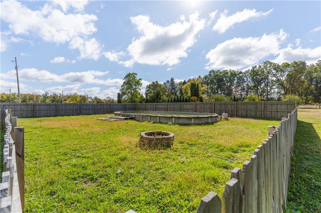 409 Bower Road Fredonia, PA 16124 - Photo 44 of 48 a view of a lake with a big yard
