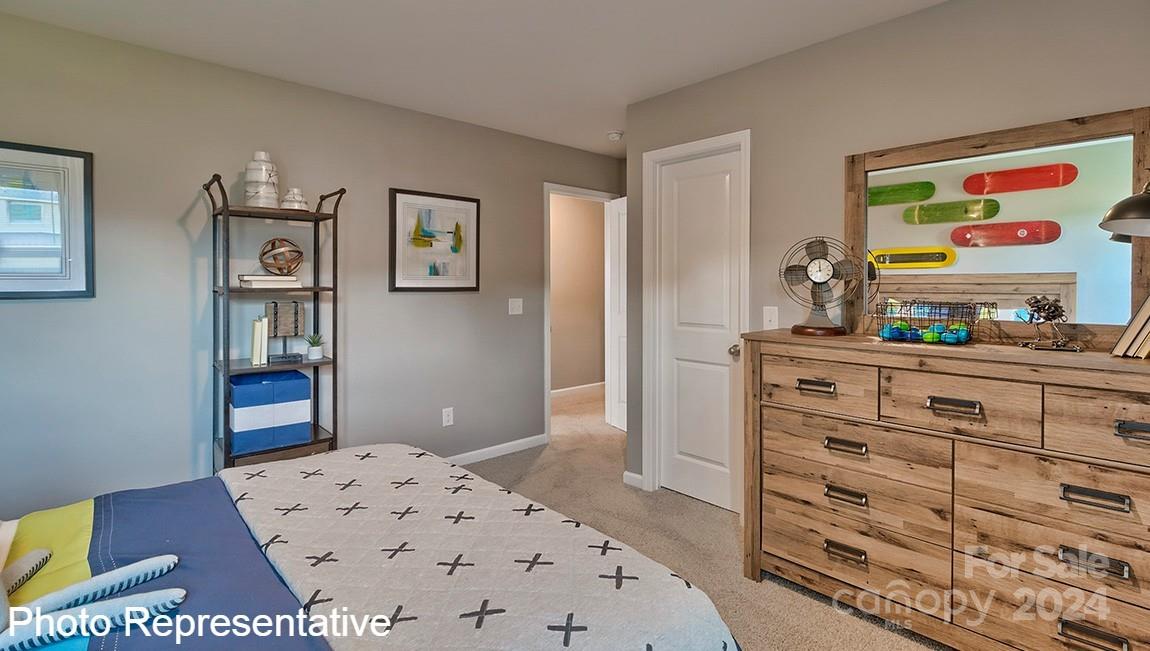 113 Dandelion Road Fletcher, NC 28732 - Photo 26 of 29 a bedroom with a bed and a dresser in it