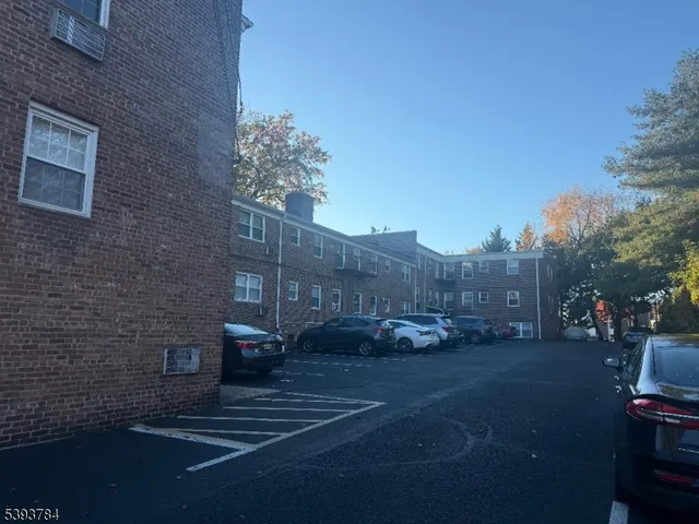 a view of a street with cars on road