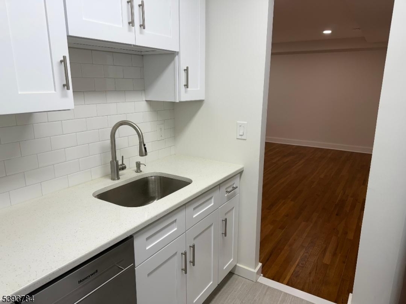 604 Chestnut Street, Unit C Union, NJ 07083 - Photo 7 of 10 a kitchen with a sink and cabinets