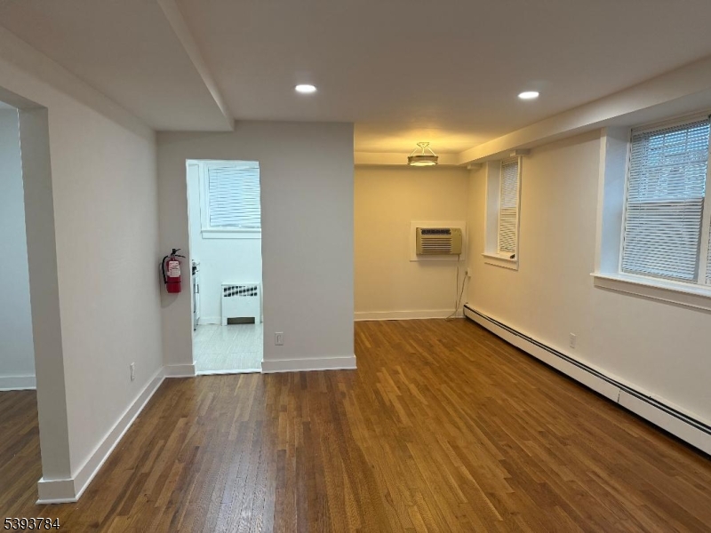 604 Chestnut Street, Unit C Union, NJ 07083 - Photo 9 of 10 wooden floor in an empty room with a window