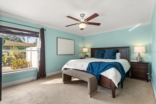 a bedroom with a bed and window