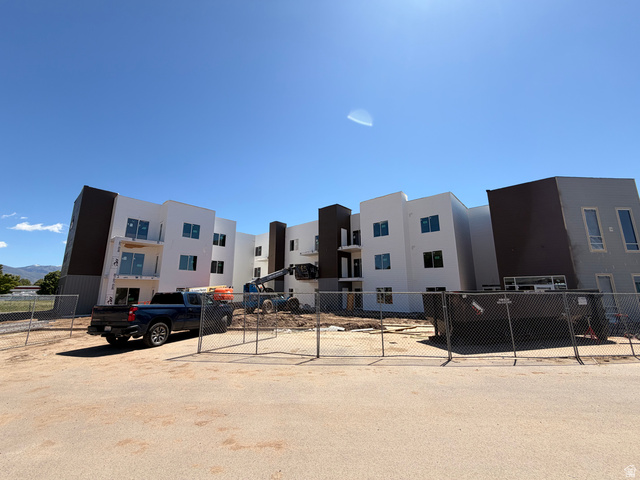 1652 North Main Street, Unit 30 Layton, UT 84041 - Photo 2 of 4 Multi-story building featuring white and dark gray exterior finishes with modern architectural lines
