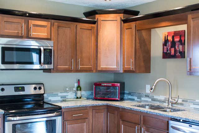 19680 North Mountain Road Timberville, VA 22853 - Photo 9 of 34 Stainless glass top range and built-in microwave.