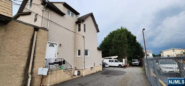 a view of a patio with couches and a flat tv screen