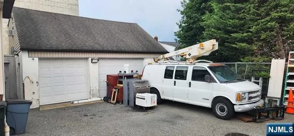 a white house with a space and parking space