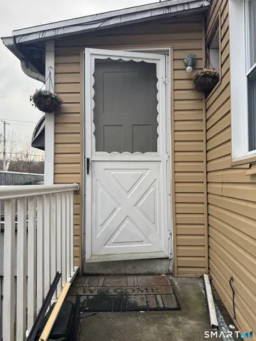 a view of a house with a door and a window
