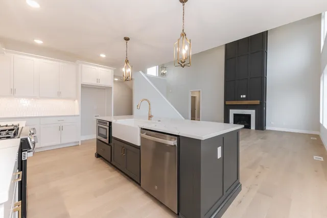 a kitchen that has a lot of cabinets in it