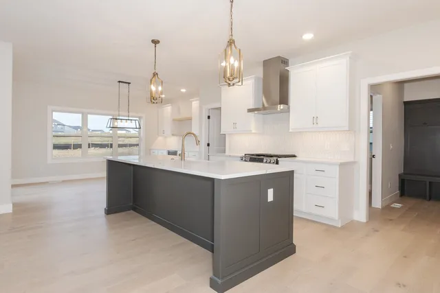 a kitchen with a sink and cabinets